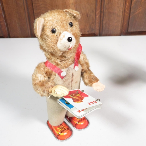 288 - 2x mechanical tin plate teddy bears reading books - both running  7