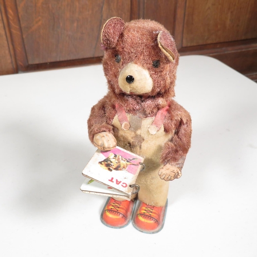 288 - 2x mechanical tin plate teddy bears reading books - both running  7