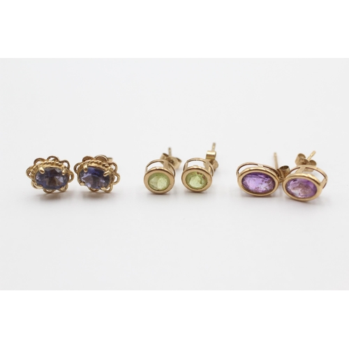 106 - 3 X 9ct Gold Paired Gemstone Stud Earrings Inc. Peridot, Amethyst & Tanzanite (2.2g)