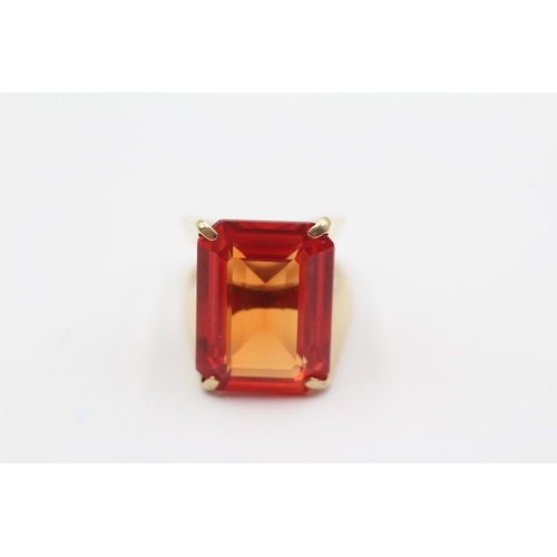 112 - 9ct Gold Fire Opal Emerald Cut Solitaire Cocktail Ring (11.7g) size N