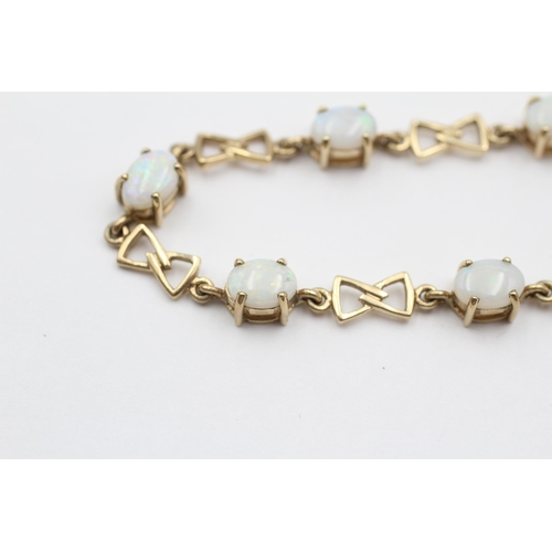 134 - 9ct Gold Opal Oval Cut And Bow Links Fancy Chain Bracelet (7.9g)