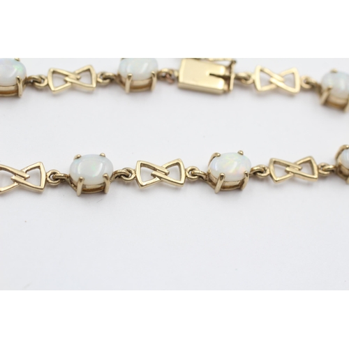 134 - 9ct Gold Opal Oval Cut And Bow Links Fancy Chain Bracelet (7.9g)