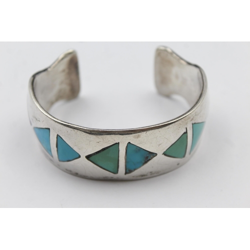 159 - A Silver Turquoise Set Native American Artist Signed Bangle (87g)