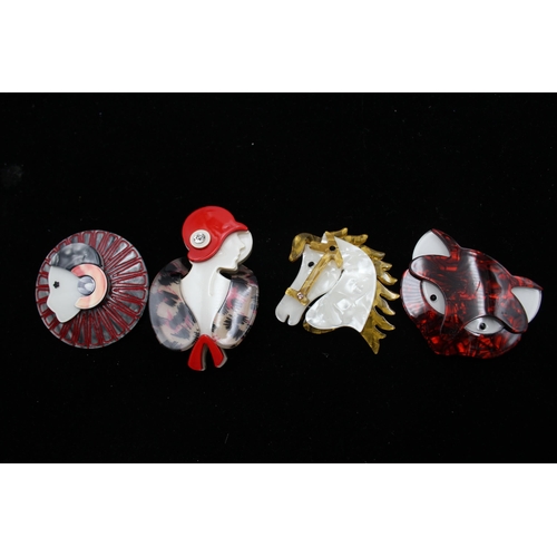 169 - Four Novelty Acrylic Brooches (54g)