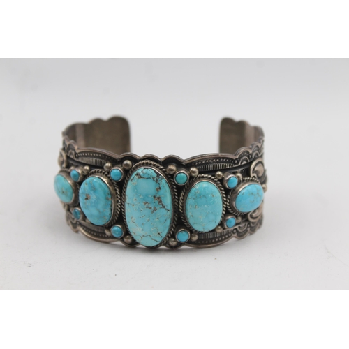 180 - A Silver Turquoise Set Native American Artist Signed Bangle (108g)