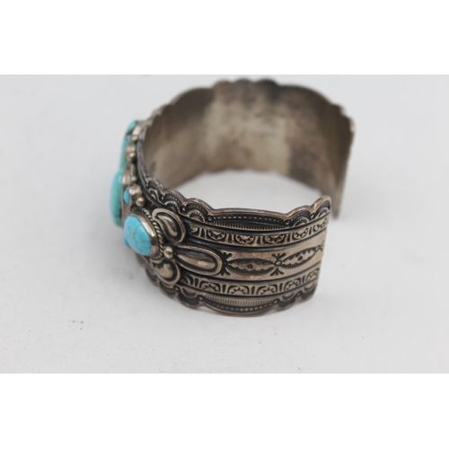 180 - A Silver Turquoise Set Native American Artist Signed Bangle (108g)