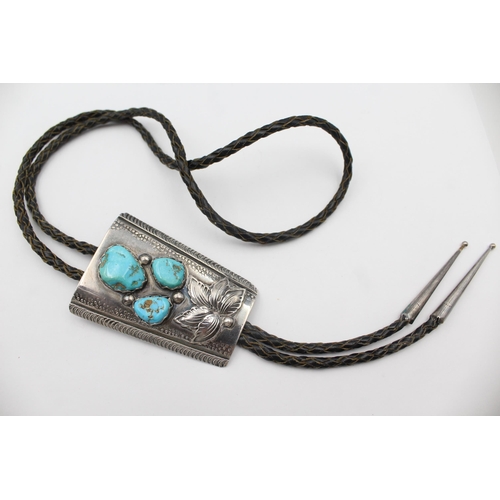 185 - A Silver Turquoise Set Bolo Tie By Zuni Artist Jose Calavaza (66g)