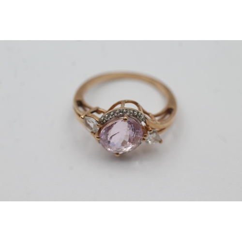 64 - 9ct Gold Pink Gemstone & Diamond Twist Setting Dress Ring (3g) size N1/2