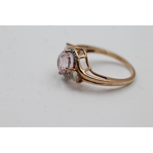 64 - 9ct Gold Pink Gemstone & Diamond Twist Setting Dress Ring (3g) size N1/2