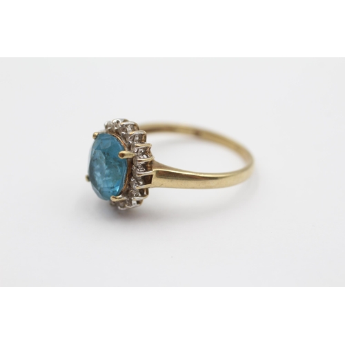 66 - 9ct Gold Blue Topaz & Diamond Halo Dress Ring (3.5g) size Q1/2