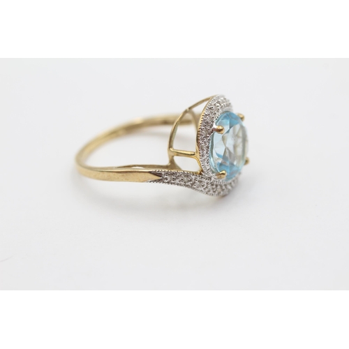 68 - 9ct Gold Blue Topaz & Diamond Halo Twist Setting Ring (3.8g) size Q