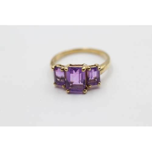 103 - 9ct Gold Amethyst Emerald Cut Graduated Trilogy Ring (2.6g) size N