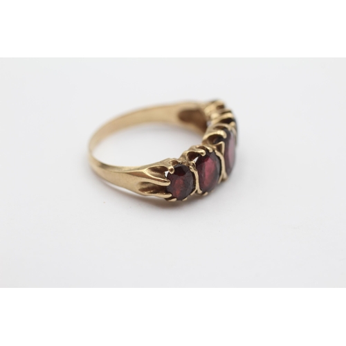 106 - 9ct Gold Garnet Oval Cut Graduated Five Stone Gypsy Ring (4.3g) size S