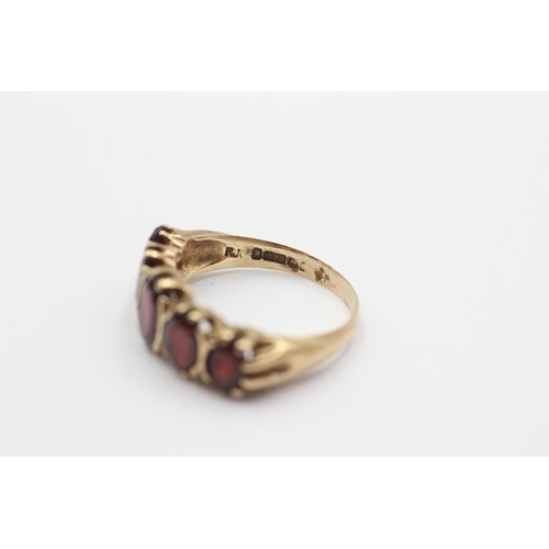 106 - 9ct Gold Garnet Oval Cut Graduated Five Stone Gypsy Ring (4.3g) size S