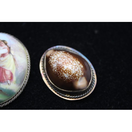 175 - Two Brooches Including A Cowrie Shell And A Porcelain Portrait (45g)