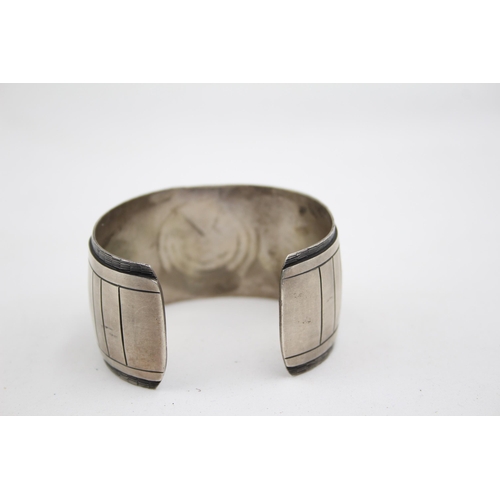 197 - A Silver Native American Cutwork Bangle (72g)