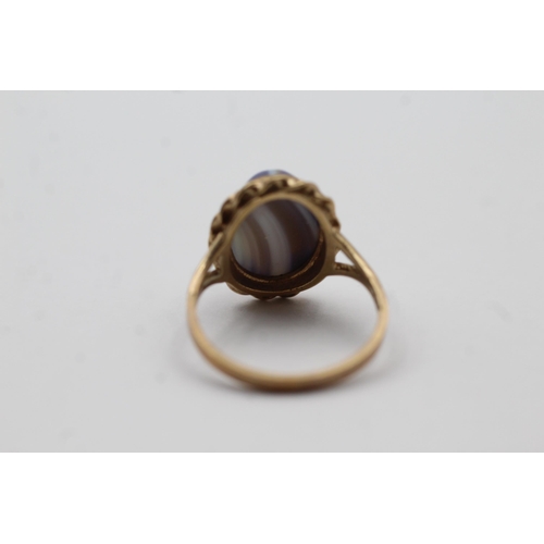 43 - 9ct Gold Agate Oval Cabochon Ornate Frame Bezel Set Split Shank Statement Ring (4.1g) size P