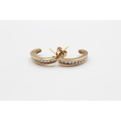 46 - 9ct Gold Diamond Channel Set Curved Stud Earrings (2g)
