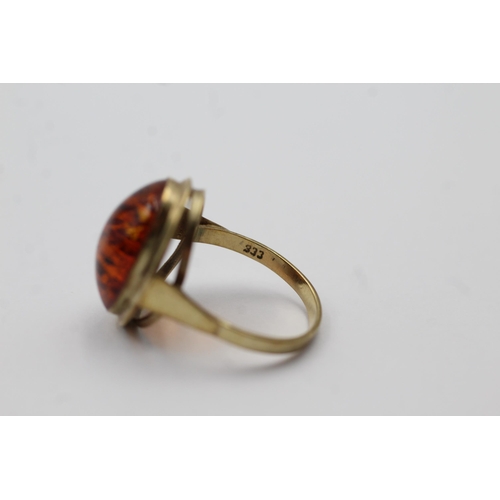 55 - 8ct Gold Amber Oval Cabochon Bezel Set Solitaire Statement Ring (2.4g) size M