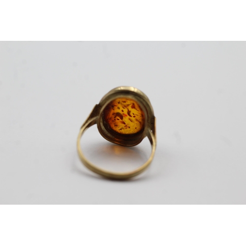 55 - 8ct Gold Amber Oval Cabochon Bezel Set Solitaire Statement Ring (2.4g) size M