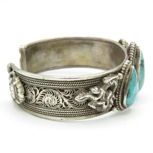 159 - A Silver Chinese Export Turquoise Set Bangle With A Dragon Design (70g)