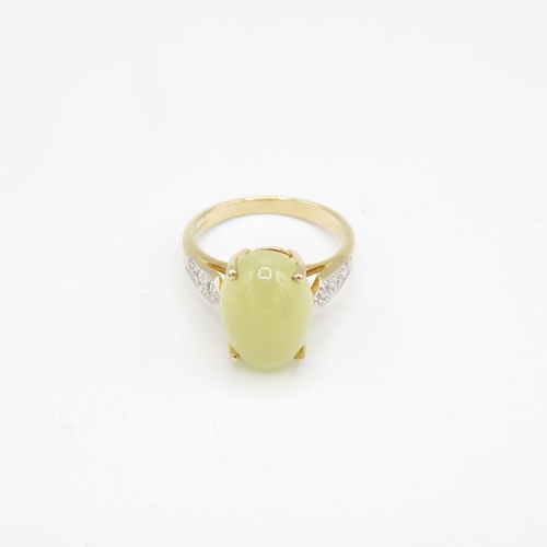 108 - 9ct gold ring with cabochon yellow stone size N  4.3g