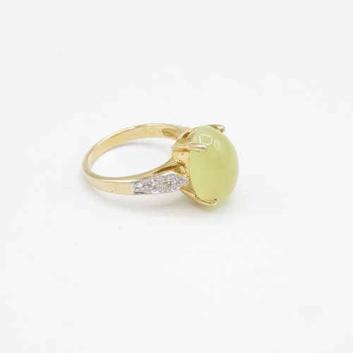 108 - 9ct gold ring with cabochon yellow stone size N  4.3g