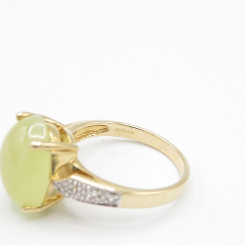 108 - 9ct gold ring with cabochon yellow stone size N  4.3g