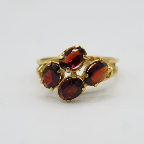 147 - 18ct gold and garnet ring size P  3.8g