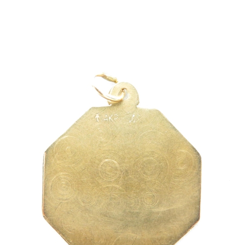 199 - 14ct gold STOP pendant  21mm wide 1.6g