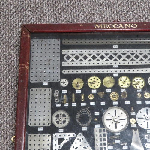 242 - 1913 Meccano part wall collage with Meccano frame glass fronted, numbering and detailing all Meccano... 