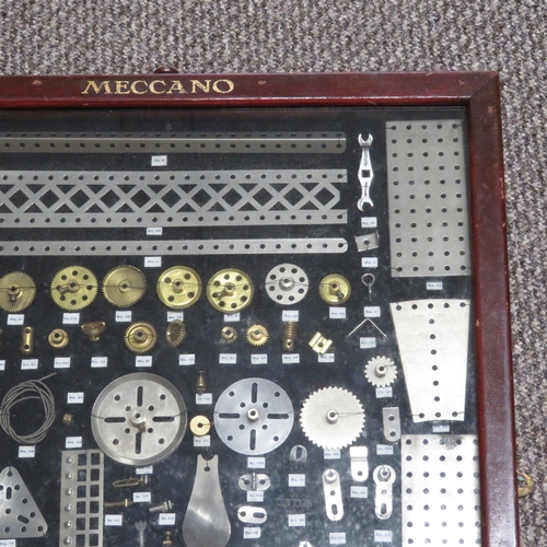 242 - 1913 Meccano part wall collage with Meccano frame glass fronted, numbering and detailing all Meccano... 