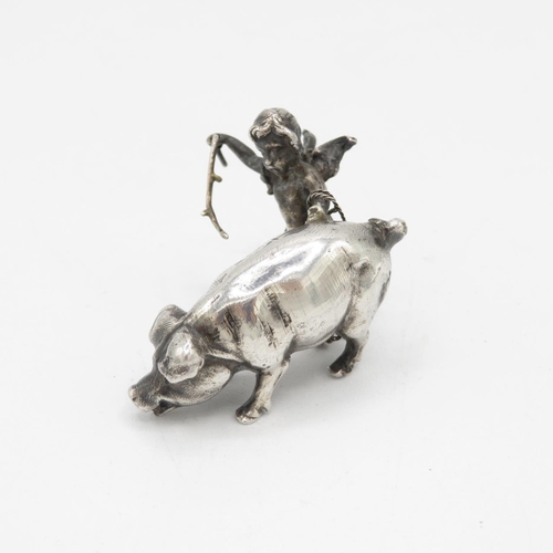 254 - Cast silver Cherub with pig 27g  50mm long