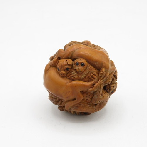 259 - Zoomorphic carved wooden Netsuke with glass eyes 45mm diameter