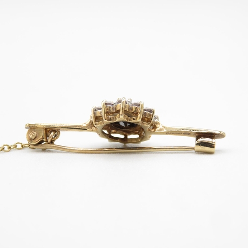 79 - 9ct gold, CZ and sapphire bar brooch 37mm long  3.4g