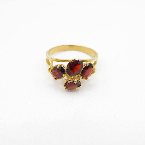 147 - 18ct gold and garnet ring size P  3.8g