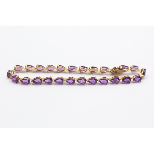 106 - 14ct Gold Amethyst Tennis Bracelet (7g)