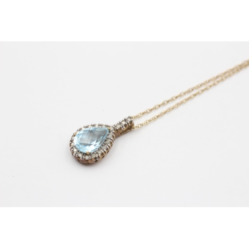 114 - 9ct Gold Diamond & Blue Topaz Pendant Necklace (2.7g)