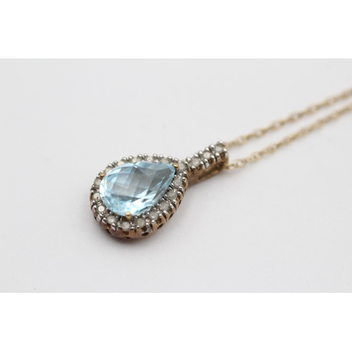 114 - 9ct Gold Diamond & Blue Topaz Pendant Necklace (2.7g)