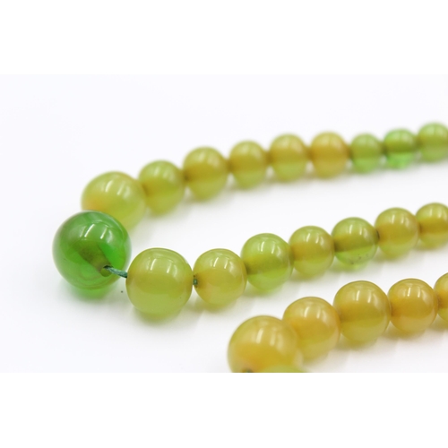 157 - Two Apple juice Bakelite Bead Necklaces For Restringing (38g)