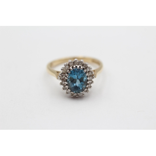 56 - 9ct Gold Diamond & Blue Topaz Oval Halo Ring (3g) Size L