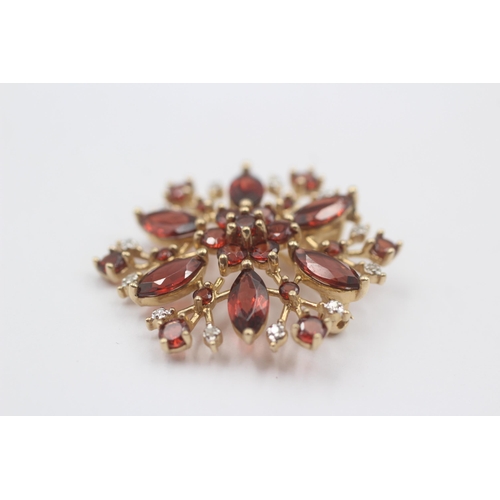 89 - 9ct Gold Diamond & Garnet Floral Cluster Brooch (5g)