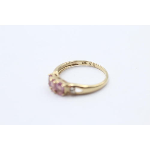 98 - 9ct Gold Pink Sapphire Three Stone Ring With Diamond Sides (1.8g) Size O