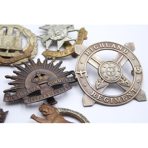 203 - 10 x Military Cap Badges Inc Royal Marines, Highland Regt, RA Spinning Wheel, Et