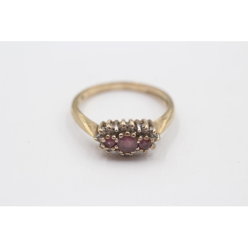 101 - 9ct Gold Ruby Three Stone Ring With Diamond Frame (3.1g) Size  S