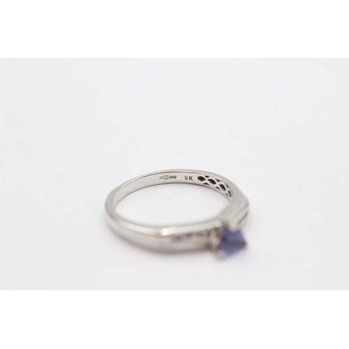 108 - 9ct White Gold Tanzanite Single Stone Ring With Diamond Set Shank (2.5g) Size  O