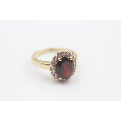 127 - 14ct Gold Tanzanite & Garnet Halo Dress Ring (4.2g) Size  O