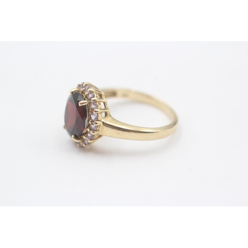 127 - 14ct Gold Tanzanite & Garnet Halo Dress Ring (4.2g) Size  O