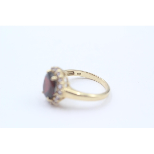 127 - 14ct Gold Tanzanite & Garnet Halo Dress Ring (4.2g) Size  O