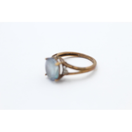 57 - 9ct Gold Coated Topaz Single Stone Ring With Diamond Sides (2.6g) Size  O